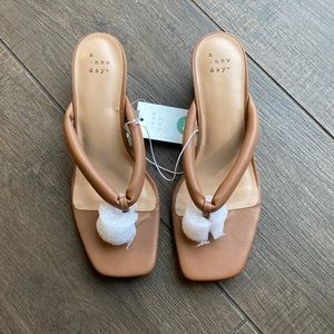 Women’s tan thong style block heel sandal.  Size 8.5 new with tags. A new day.